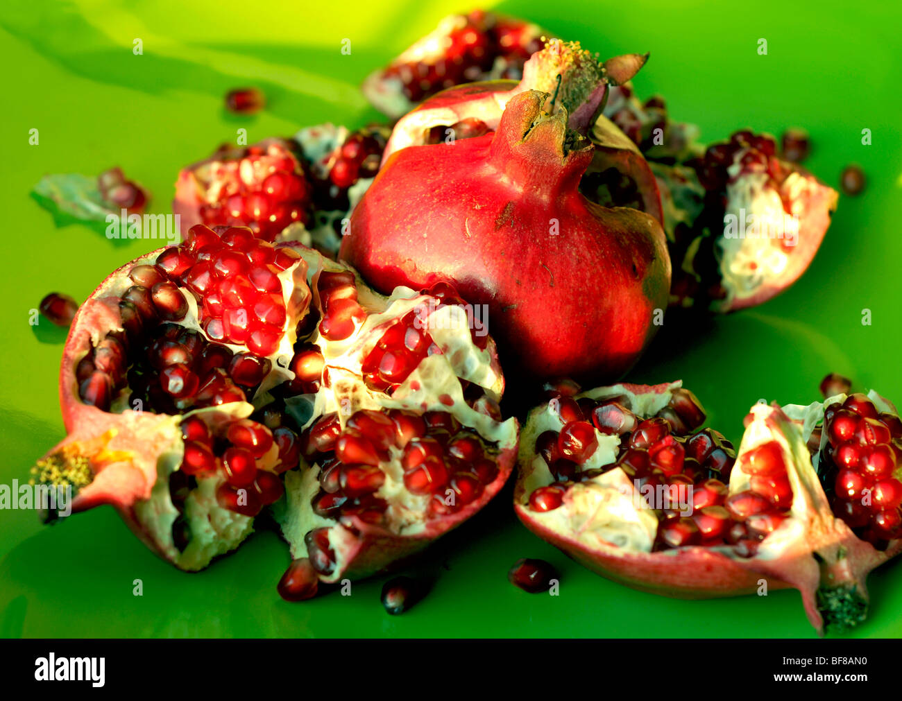pomegranate on green Stock Photo