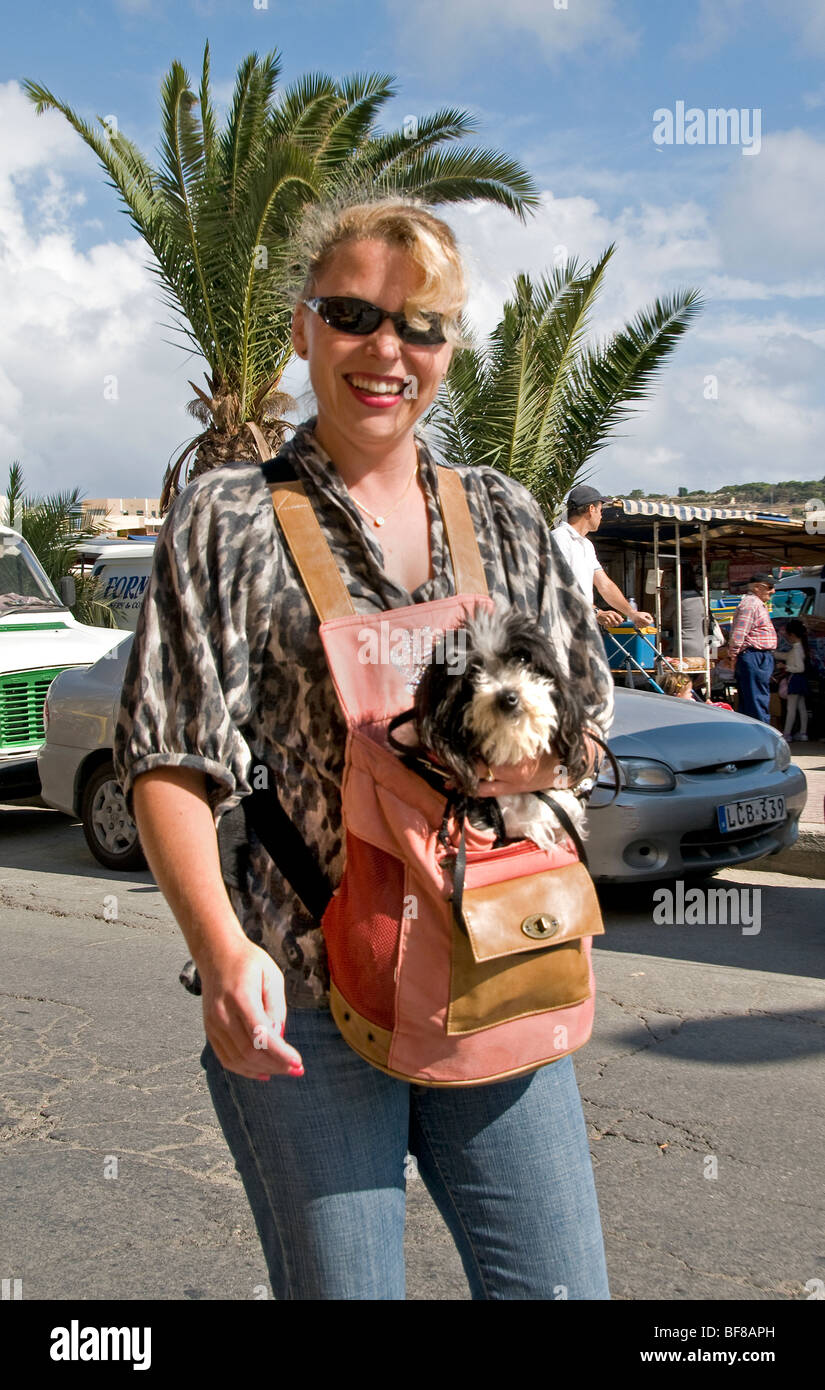 Malta Maltese Marsaxlokk Bay woman bag small dog Stock Photo