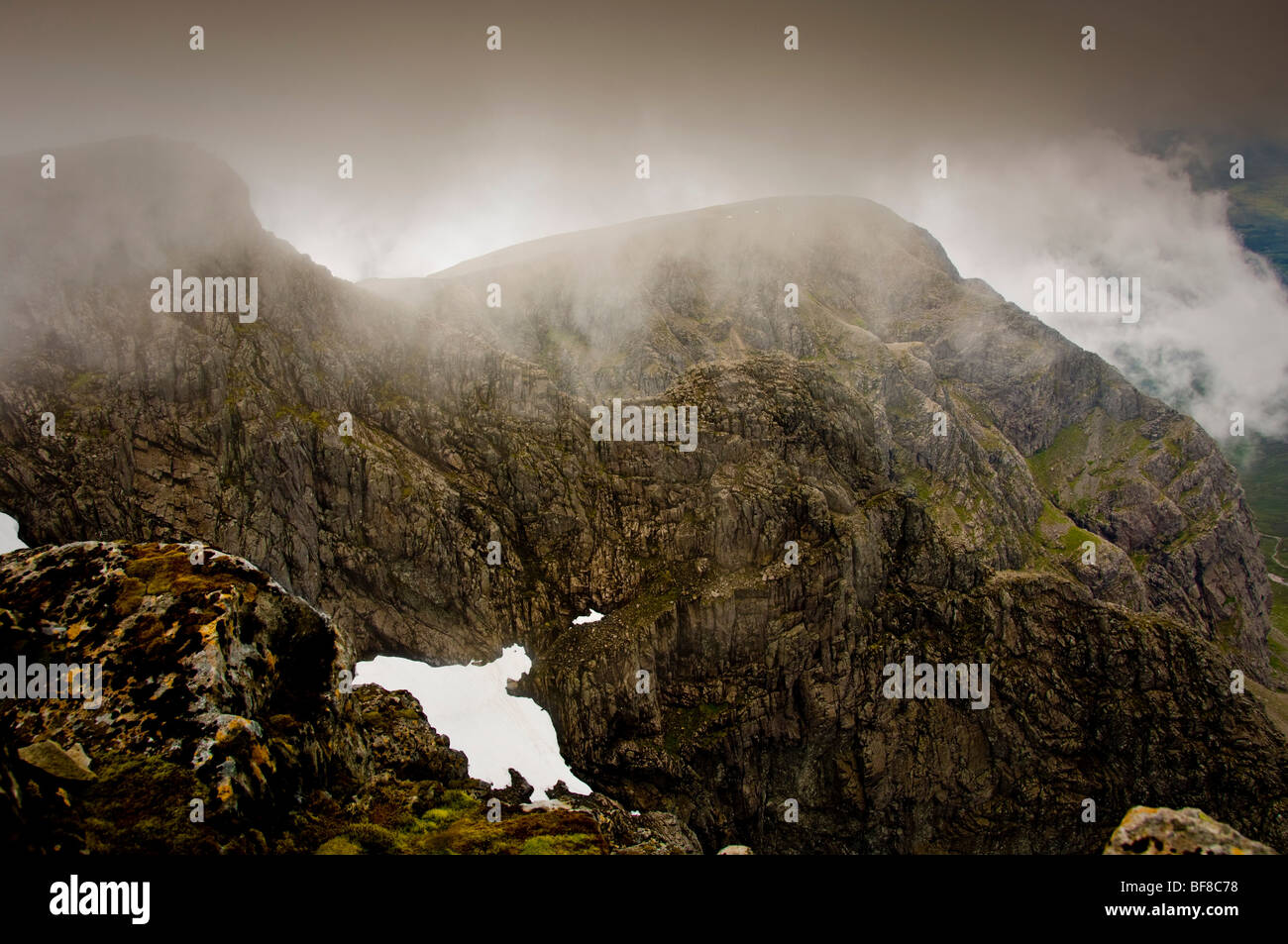 Tower Ridge from summit of Ben Nevis, in summer shrouded in clouds. Scotland Stock Photo Alamy