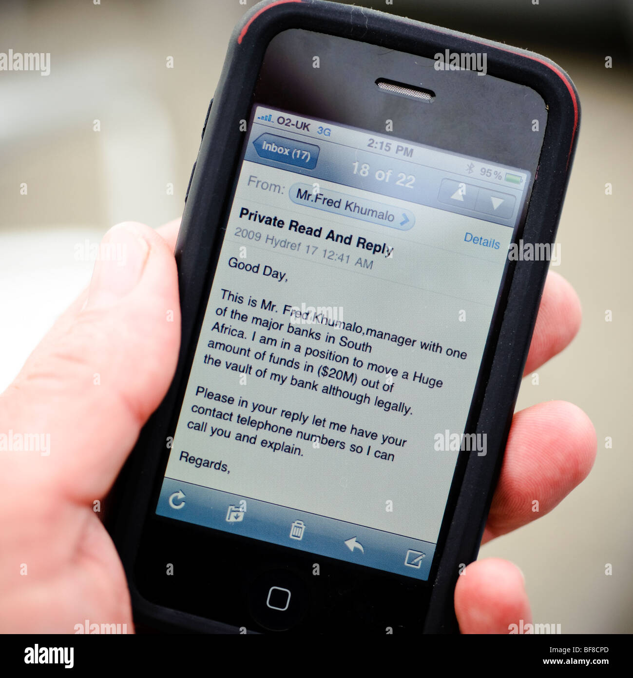 reading a phishing email fraud scam letter on an apple iPhone, UK Stock
