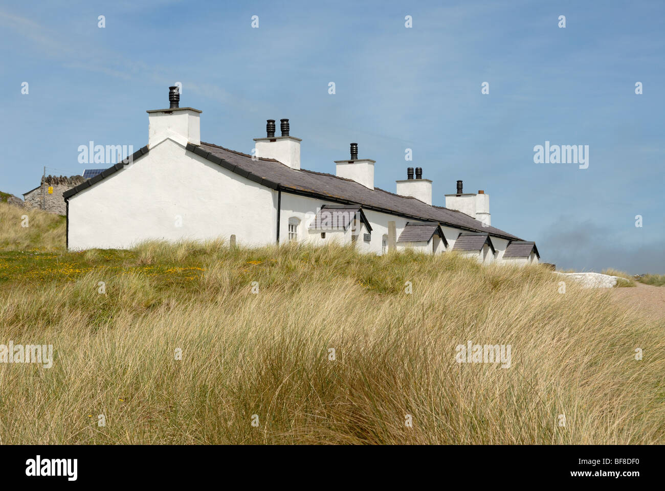 Terrace of Pilot's Cottages on Ynys Llanddwyn on Anglesey Stock Photo