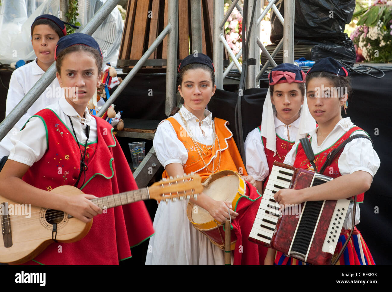 Madeiran children in traditional costume playing musical instruments and dancing, Funchal, madeira Stock Photo