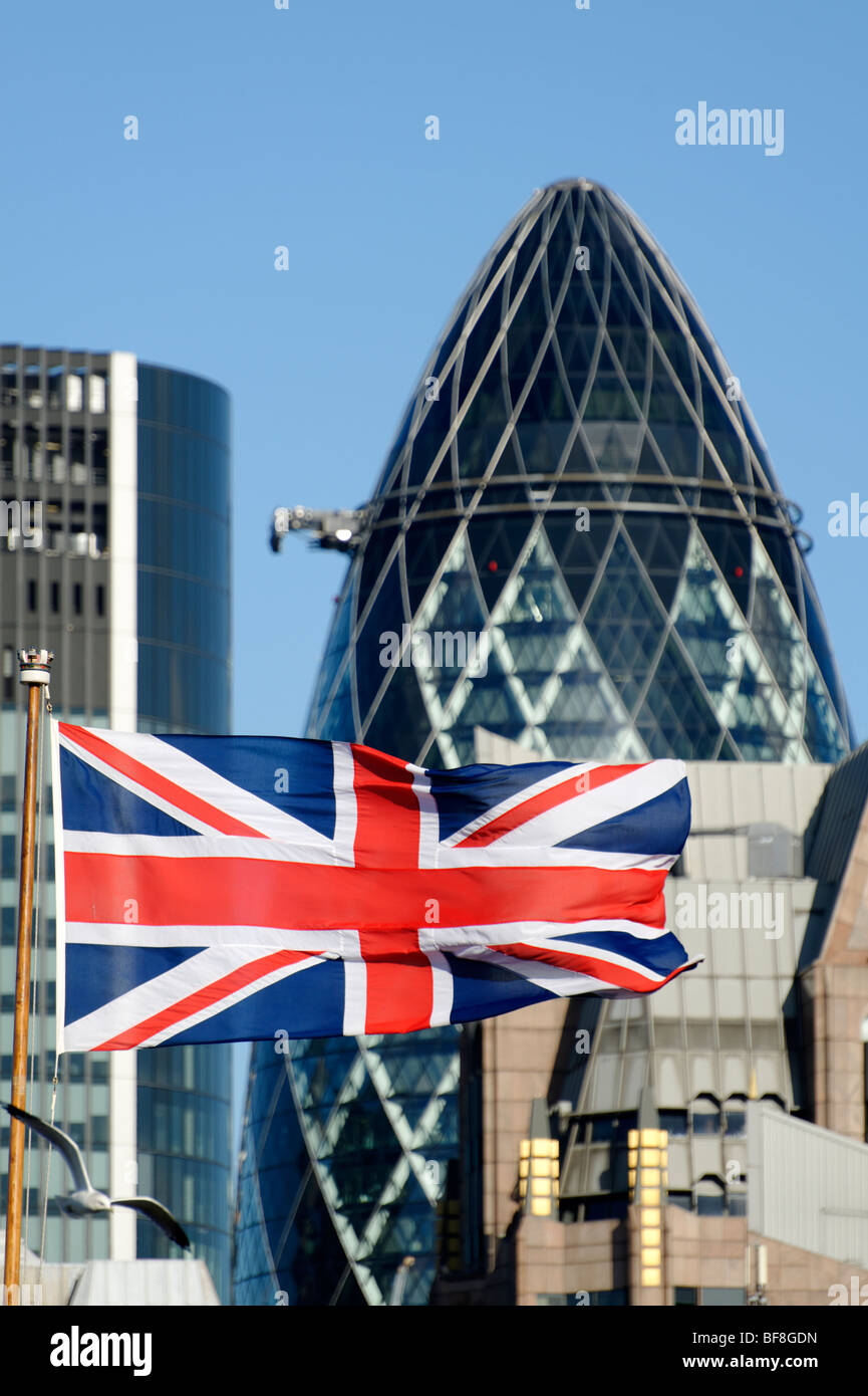 Union Jack flag with the Swiss Re building in the background. City of London. UK 2009. Stock Photo