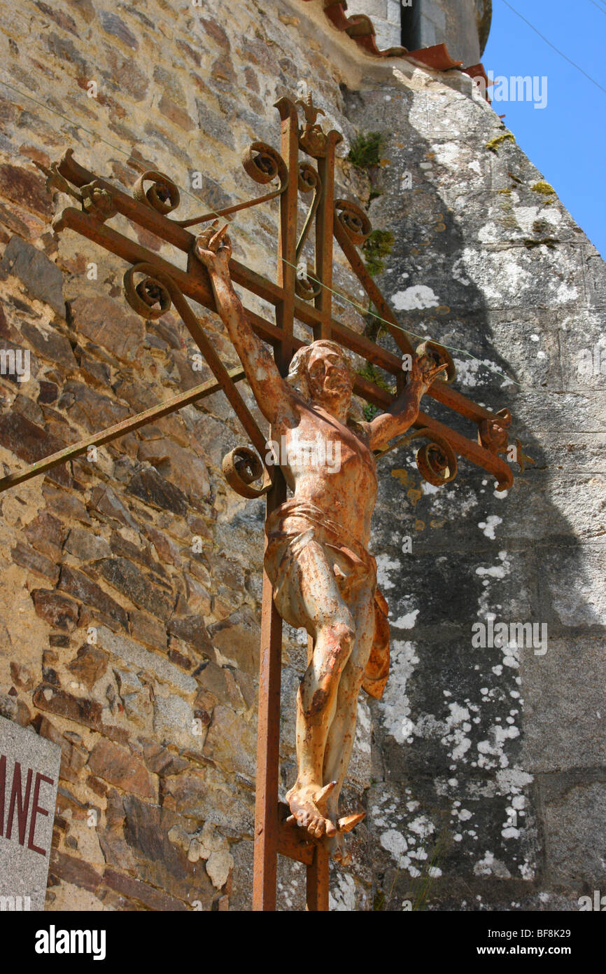 crucifix of Christ outside the old church at the historic site of Oradour-sur-Glane, France Stock Photo