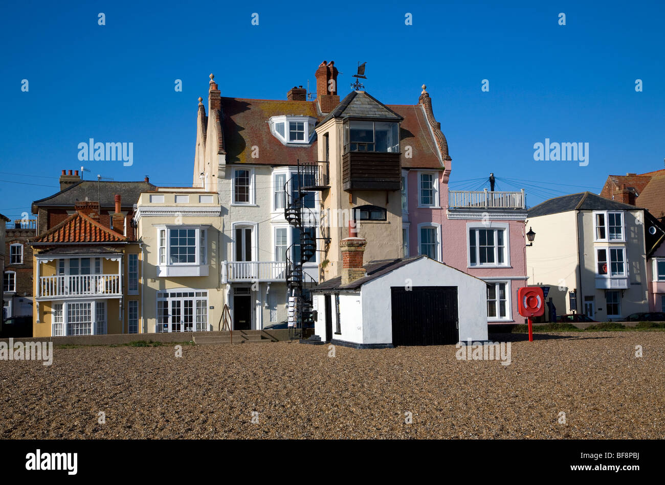 Seaside buildings along the front, Aldeburgh, Suffolk, England. Disused lifeboat station building. Stock Photo