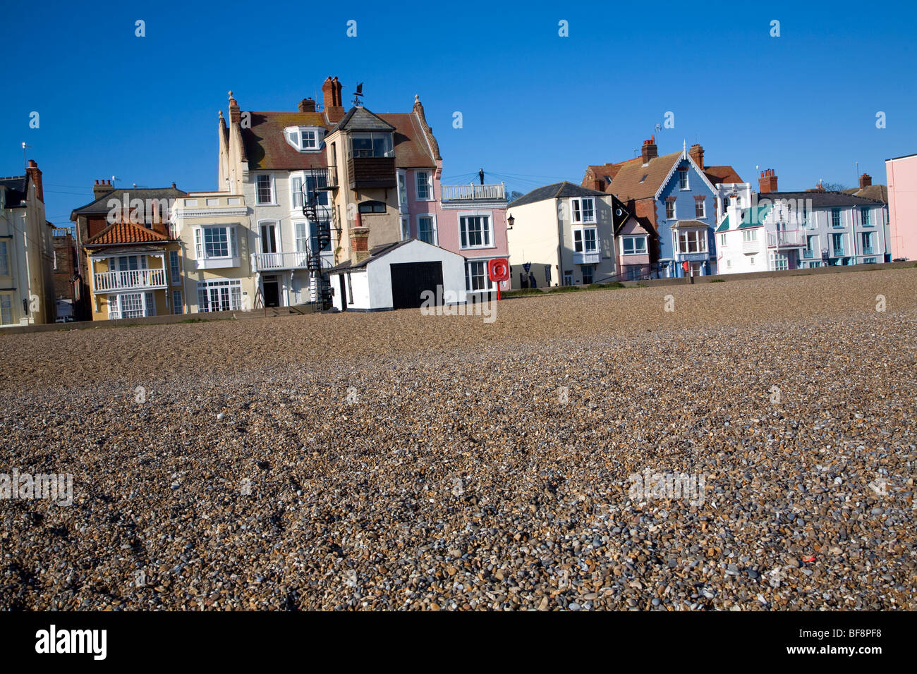 Seaside buildings along the front, Aldeburgh, Suffolk, England. Disused lifeboat station building. Stock Photo