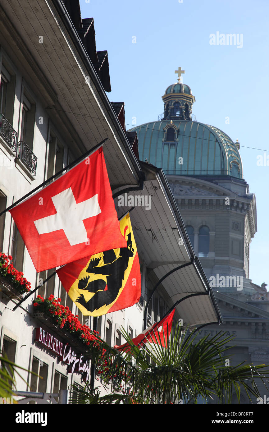 Swiss flags flying in Theater Platz, Bundeshaus in BG, Bern Stock Photo