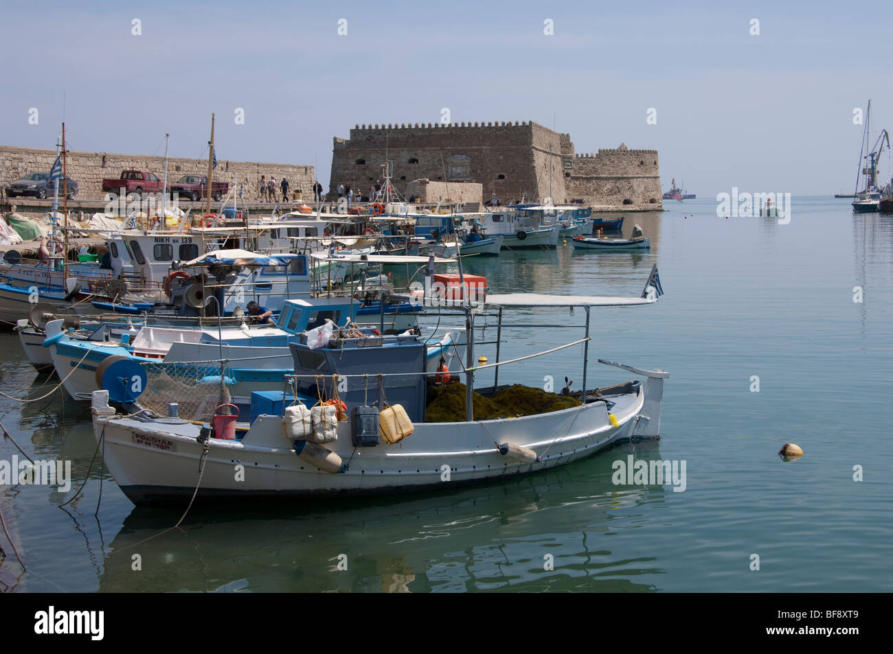 Heraklion harbour is full of fishing vessels and boats which offer trips around the island of Crete and the coastal waters. Stock Photo