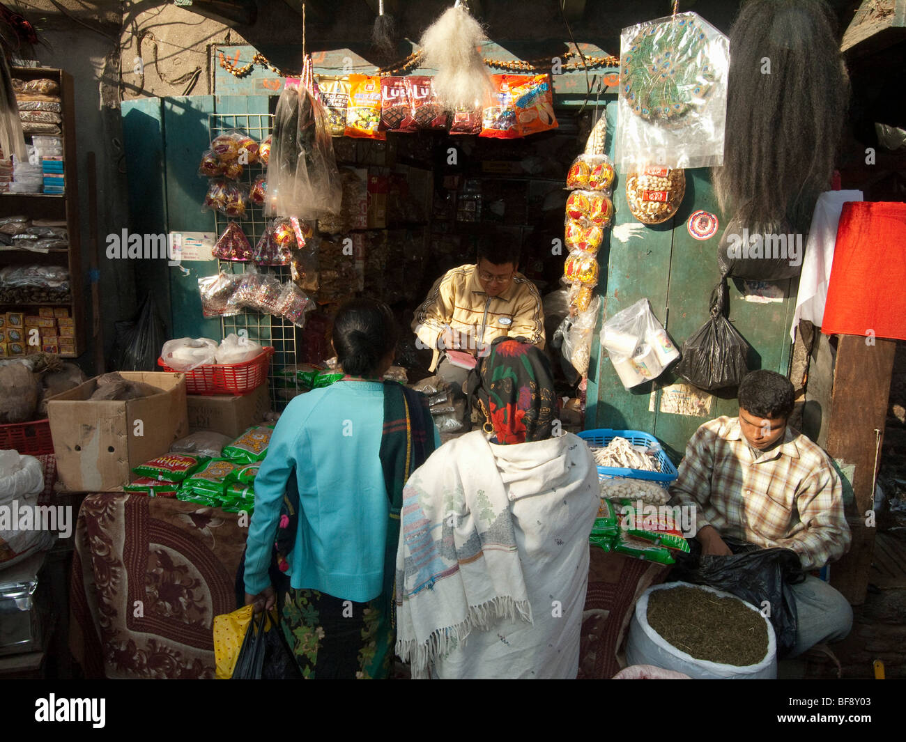 In the central squares of the city, local sellers sit in their side stalls offering a variety of goods from fresh food and Stock Photo