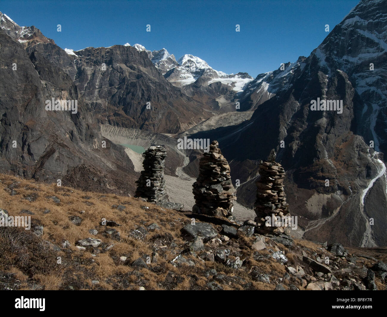 Mount Mera is the high peak in Mera National park. Cairns beside the path commemorate people who have passed that way. Nepal. Stock Photo