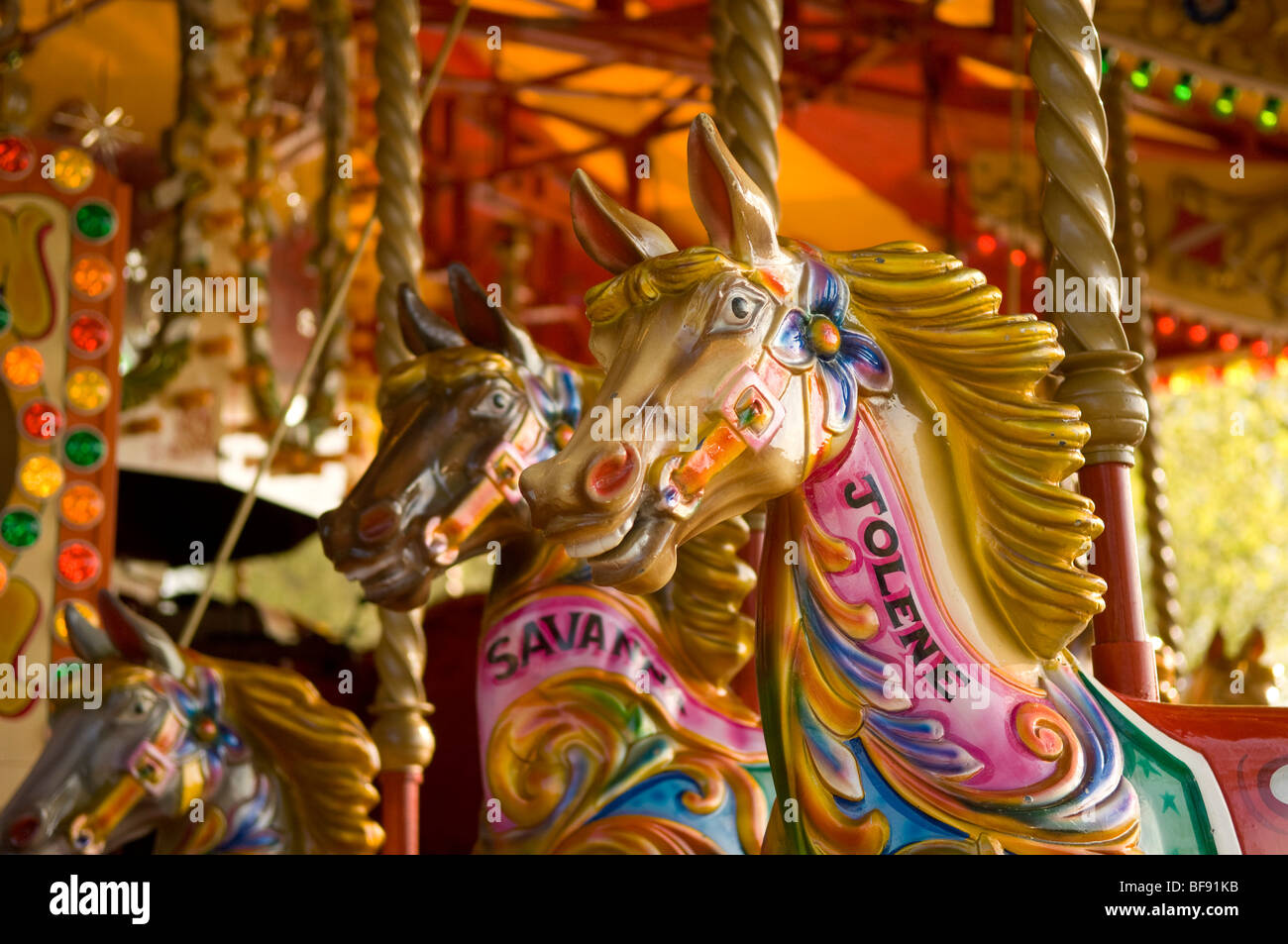 Traditional horse carousel. Horses painted in traditional fairground bright colours. London. South Bank. Stock Photo