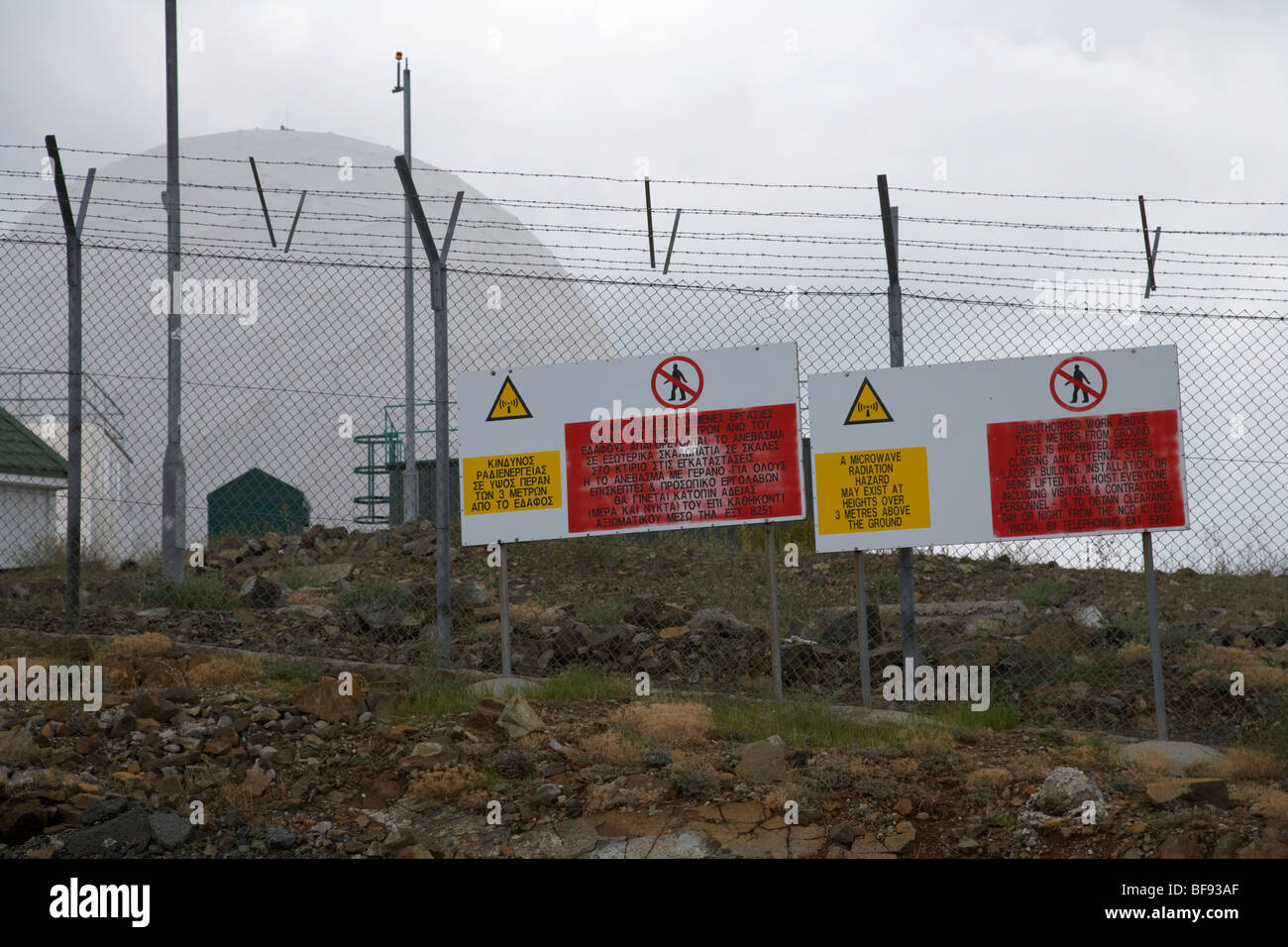 radiation warning signs on fence at british military observation post raf troodos on mount olympus republic of cyprus Stock Photo
