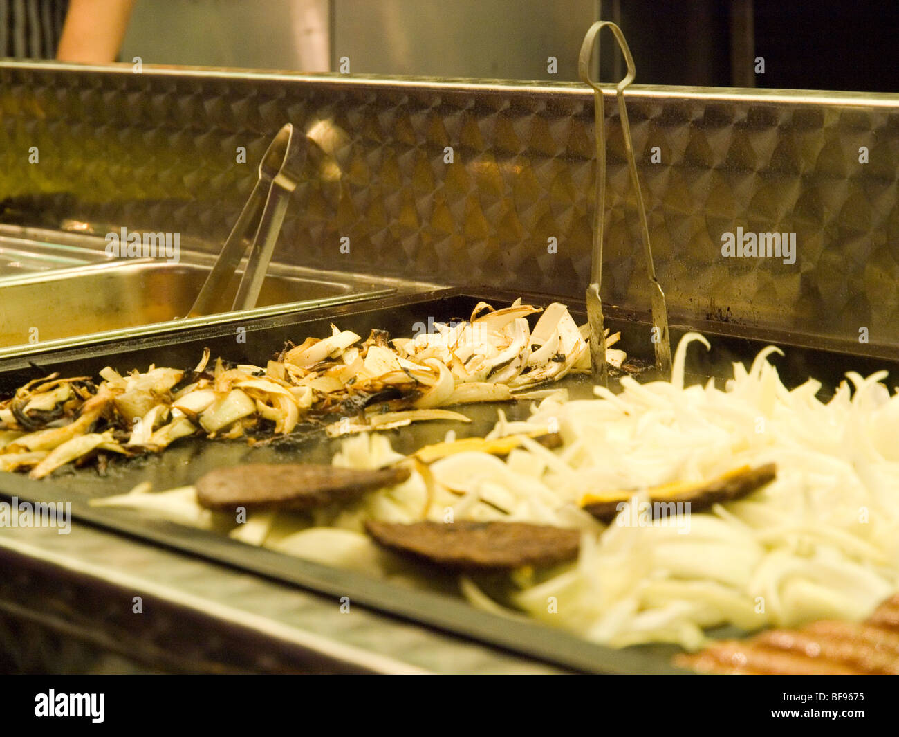 Close up of food cooking at Goose Fair in Nottingham, Nottinghamshire England UK Stock Photo