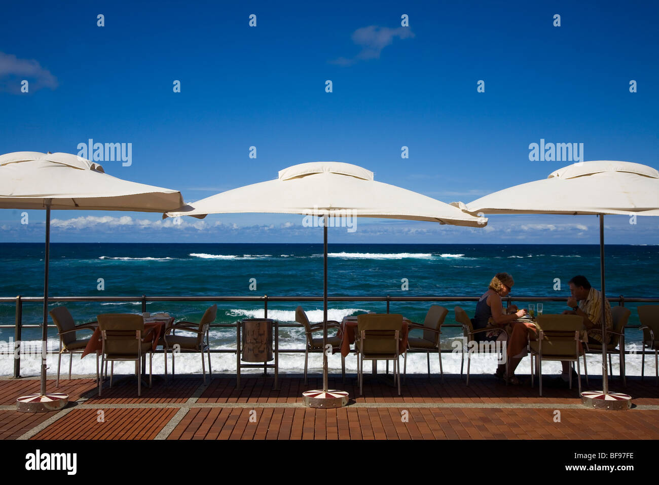 Cafeteria parasols along Canteras Beachfront Stock Photo