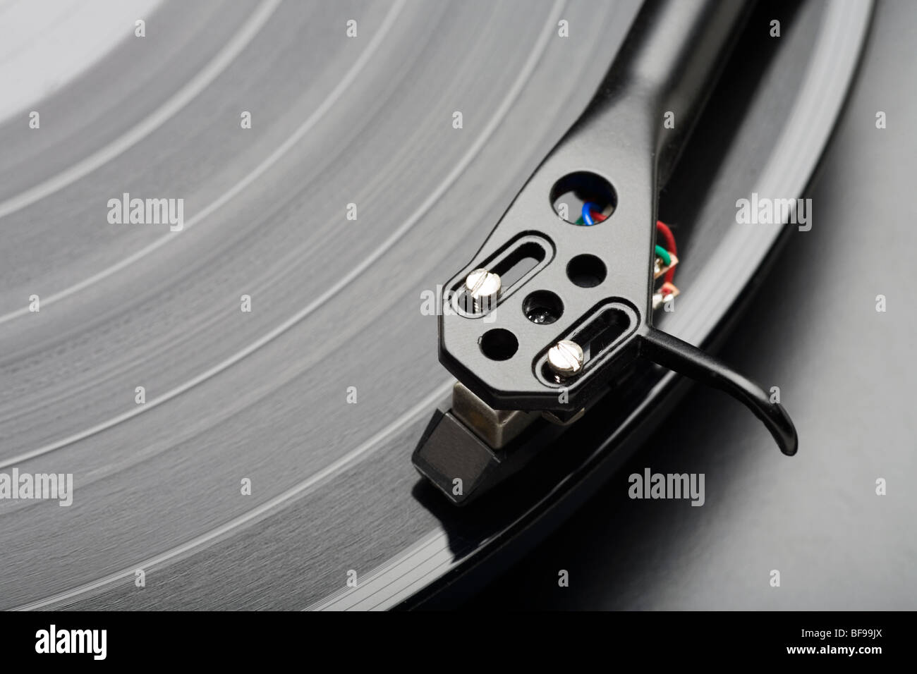 Phonograph needle on a LP Vinyl Record. Stock Photo