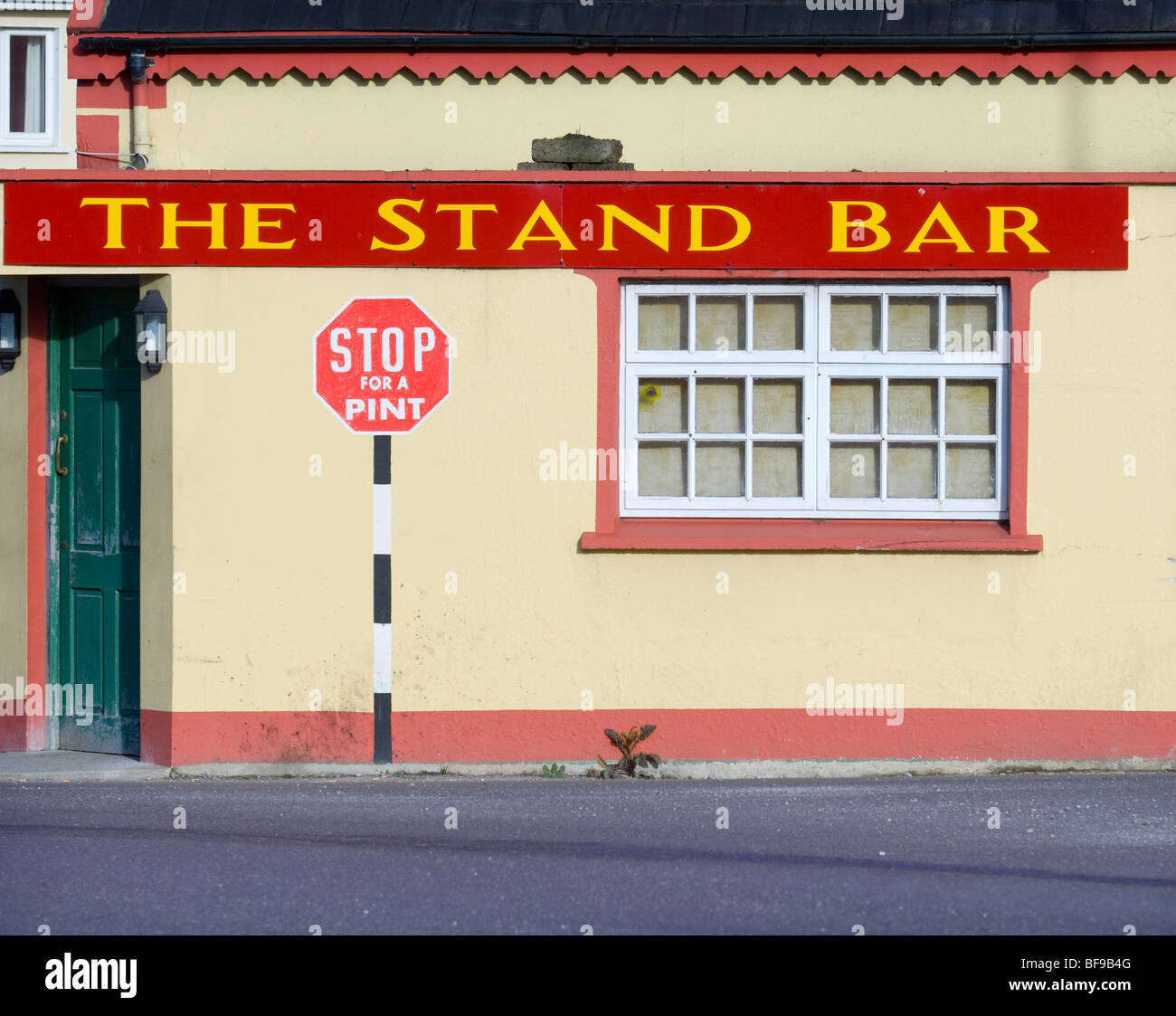 road sign painted on Traditional Irish pub in southwest Ireland Stock Photo