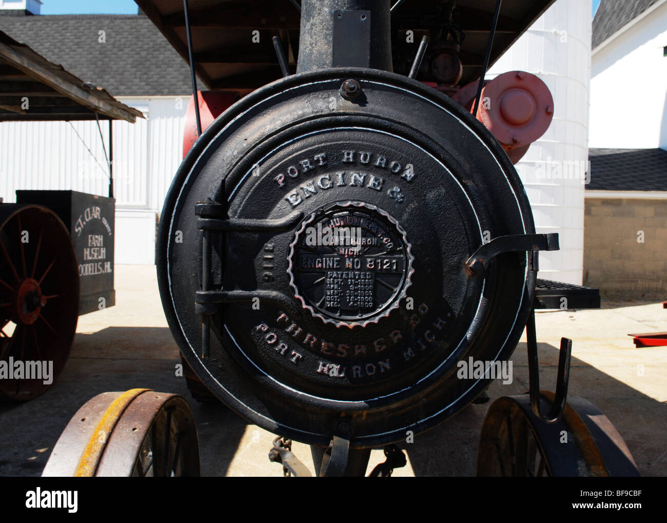 A Port Huron Engine Thresher steam engine is part of an antique farm machinery display at a midwest farm museum. Stock Photo