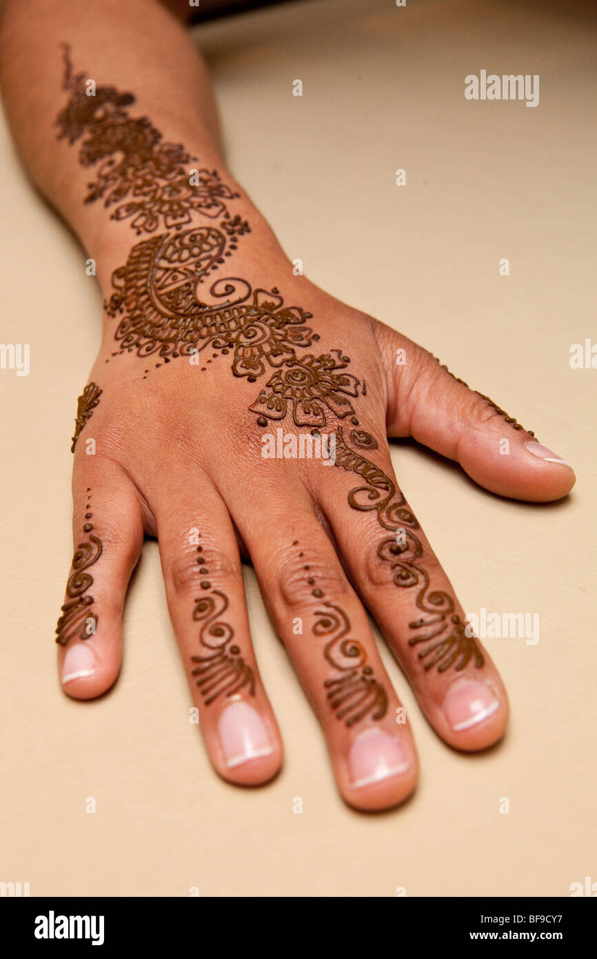 Henna on girls hand and arm Stock Photo