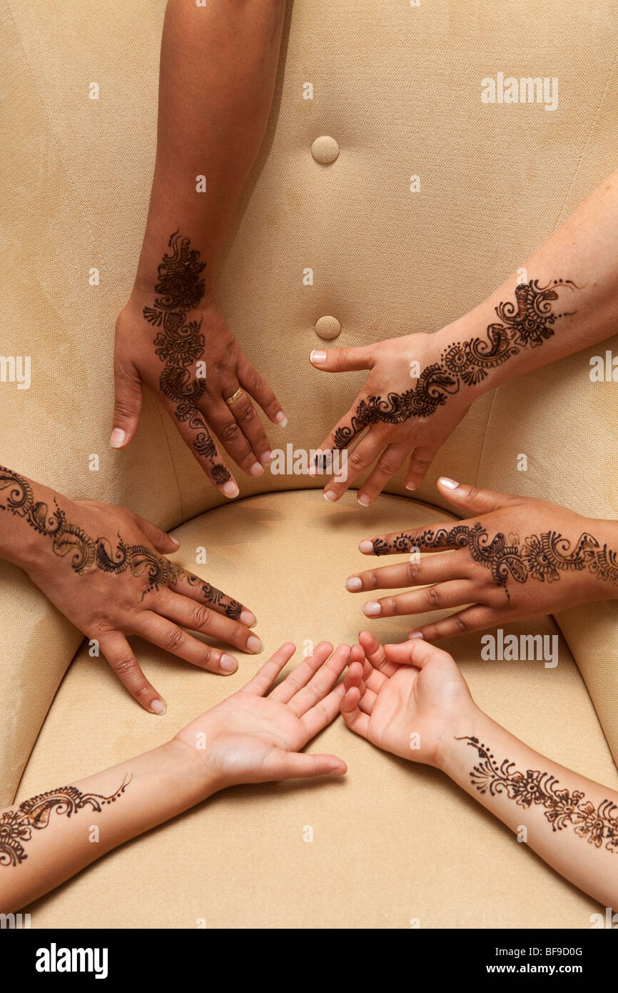 Many hands with henna Stock Photo
