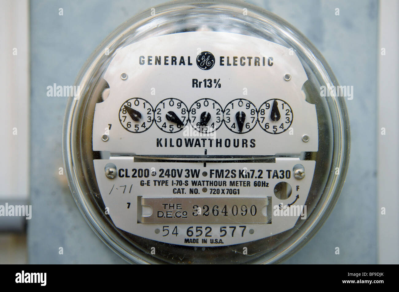 An electric meter tells a utility company how much electricity a home is  using. The dials are read left-to-right Stock Photo - Alamy