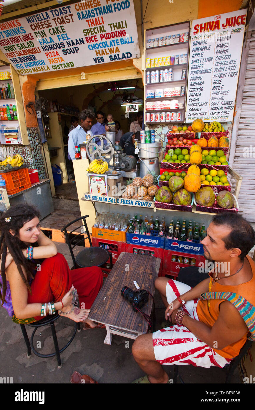 Tourists at a juice stand and restaurant in Pushkar in Rajasthan India Stock Photo