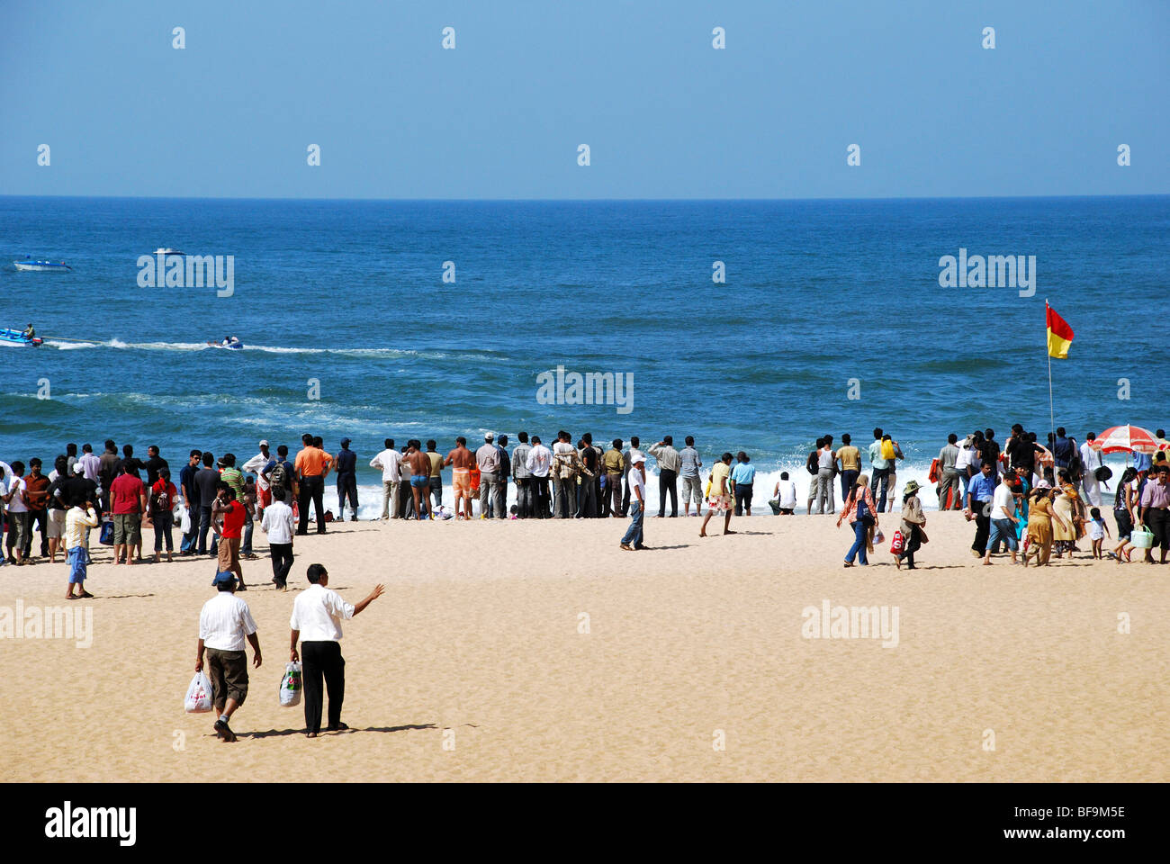 Calangute beach with tourists Stock Photo