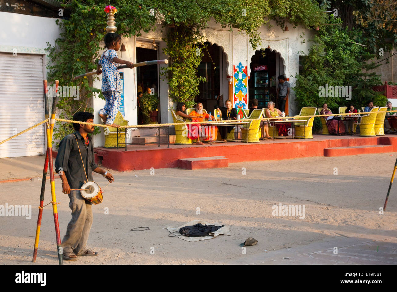 Little girl walking a tightrope at the Pushkar Mela in Pushkar in Rajasthan India Stock Photo
