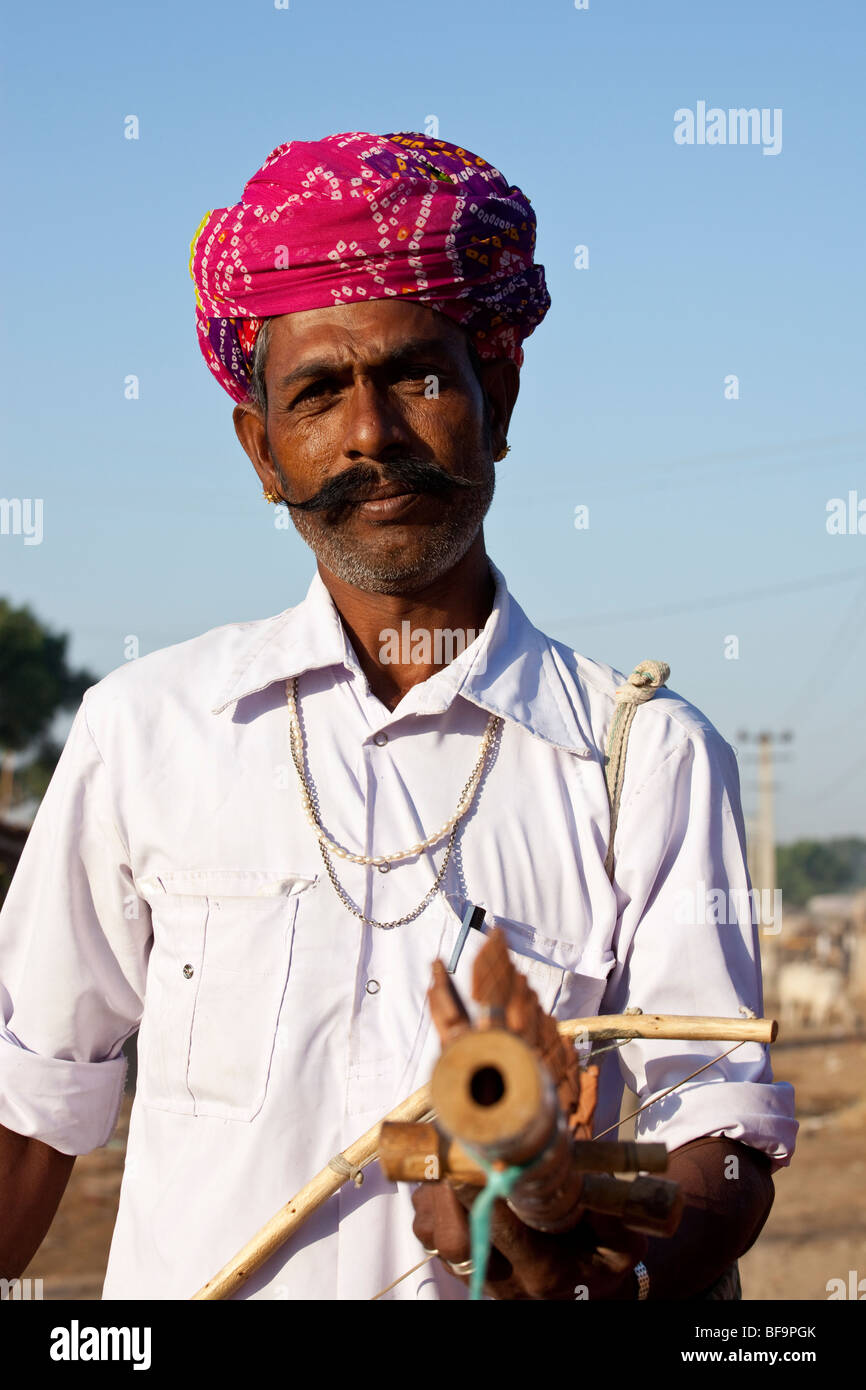 Folk Musician at the Camel Fair in Pushkar in Rajasthan India Stock Photo