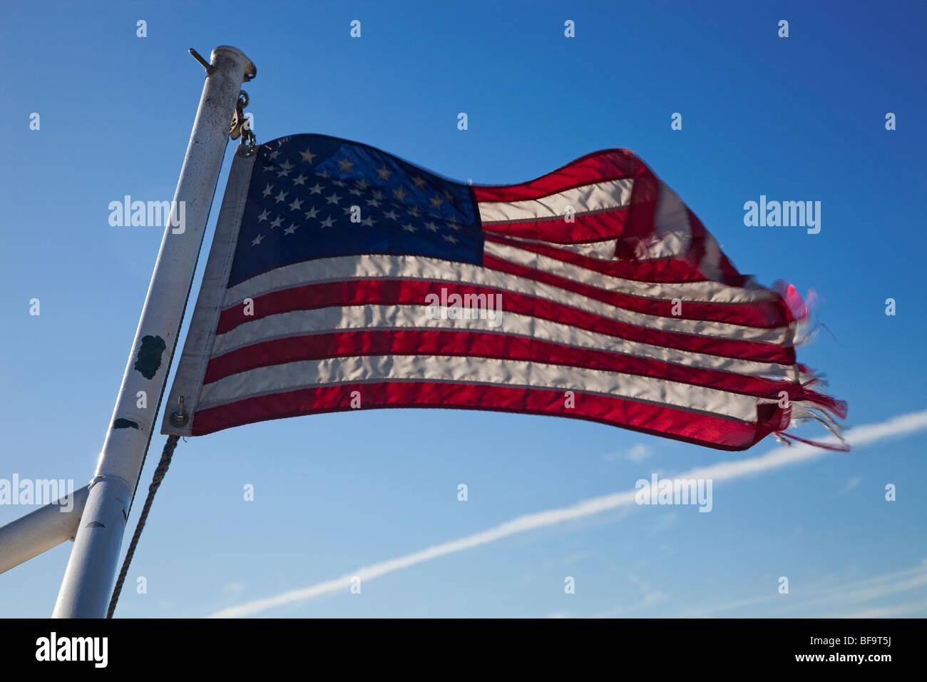 america america flag broken tatters poor economy recession Stock Photo