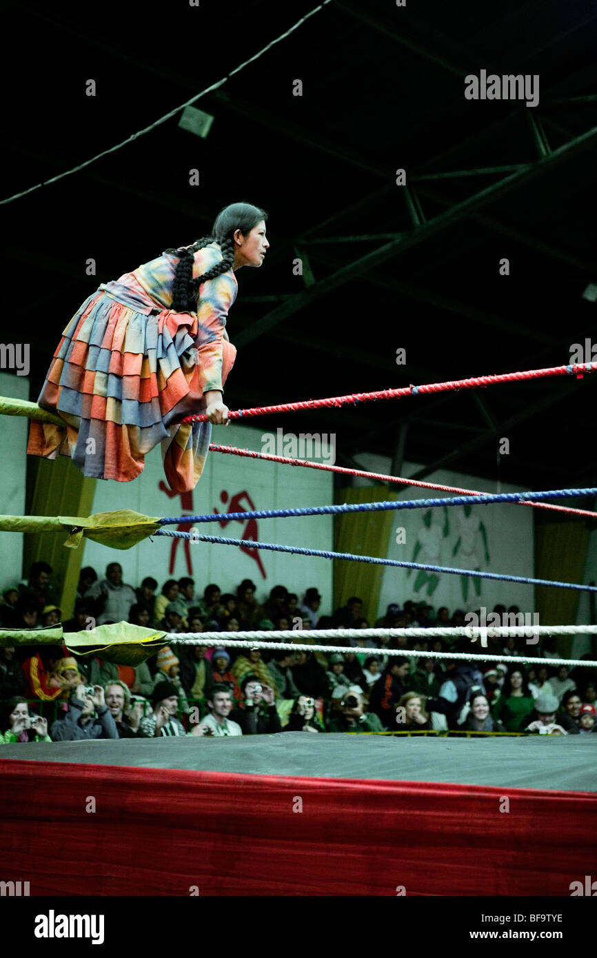Cholita, traditionally dressing Aymara Indian lady, preparing for show wrestling match in El Alto, La Paz, Bolivia. Stock Photo