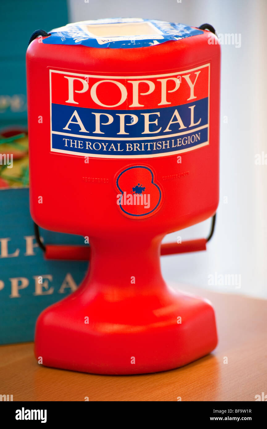 The Royal British Legion poppy appeal. Charity collection tin with a red poppy on the front taking money for old soldiers. Stock Photo