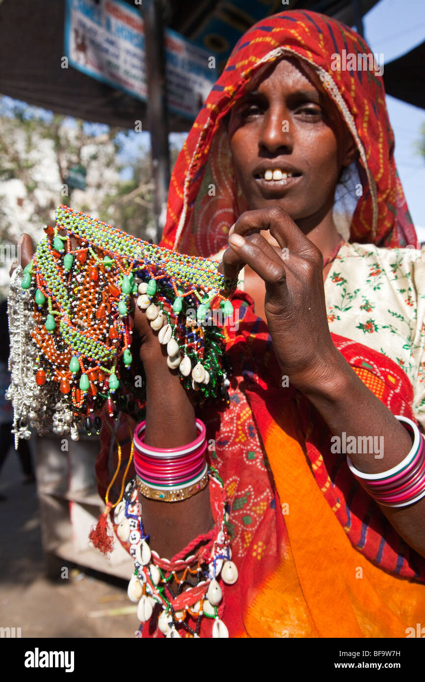 Woman selling jewelry at the Camel Fair in Pushkar in Rajasthan India Stock Photo