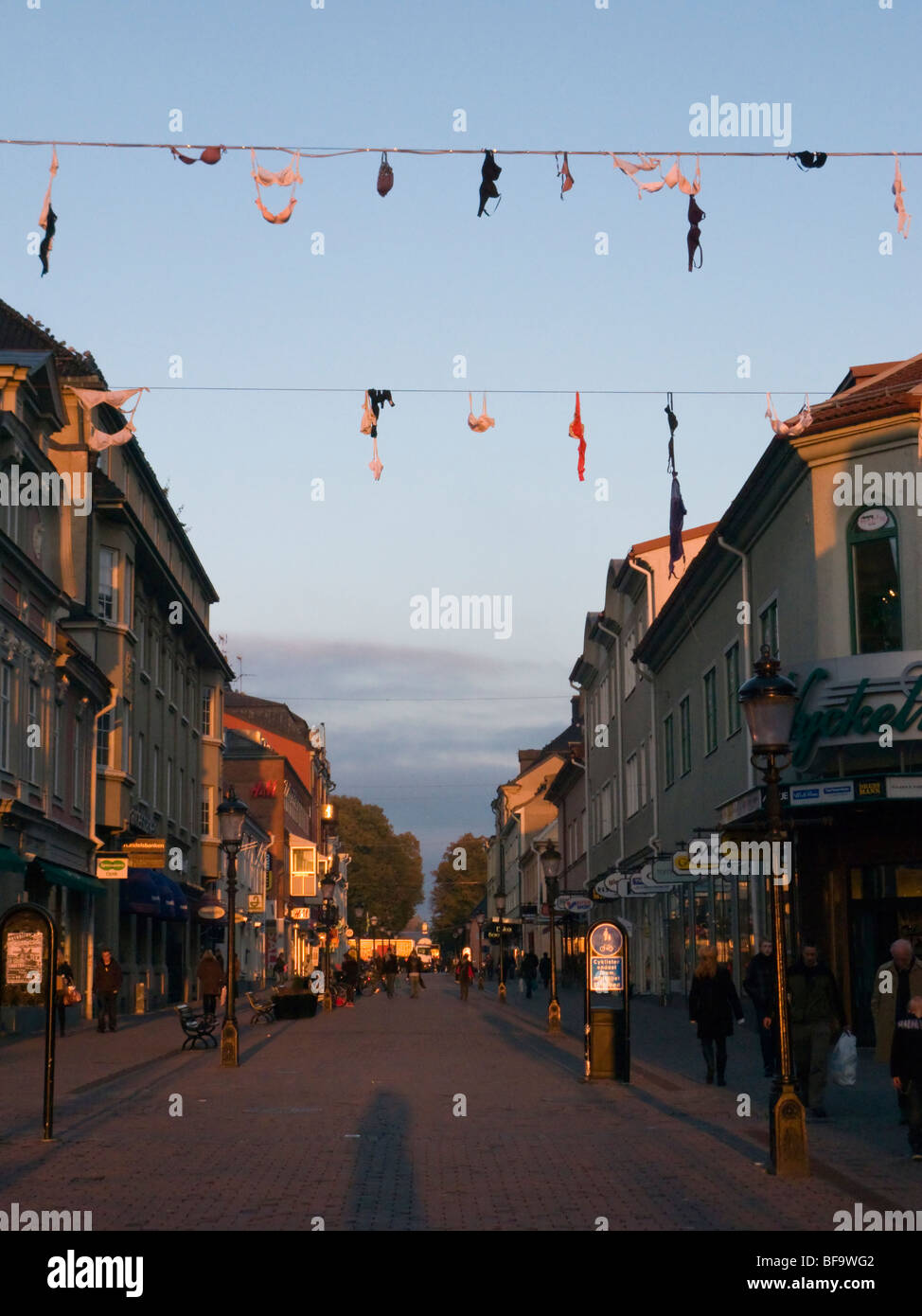 Bras hanging above a street in Nyköping, Sweden. Part of a Pink Ribbon jippo. Stock Photo