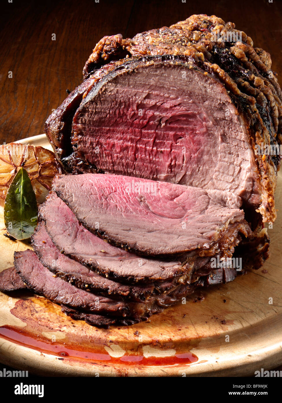 Irish roast beef joint with garlic Stock Photo Alamy