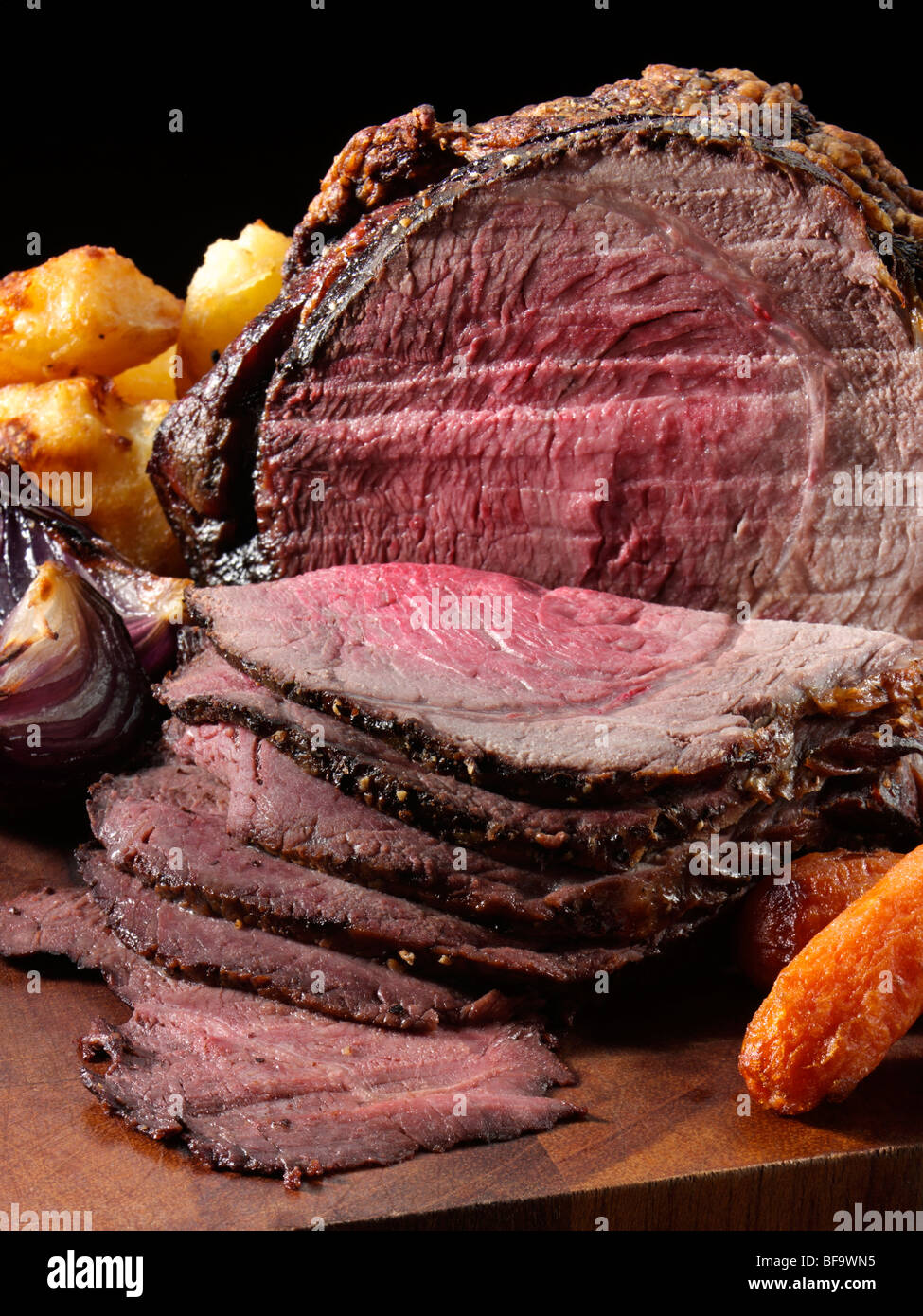 Irish roast beef joint with vegetables Stock Photo Alamy