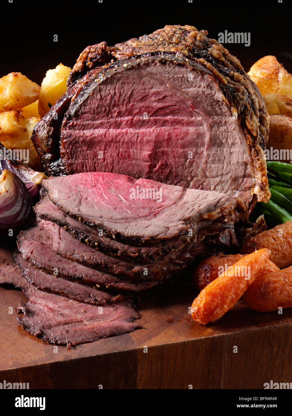 Irish roast beef joint with vegetables Stock Photo Alamy