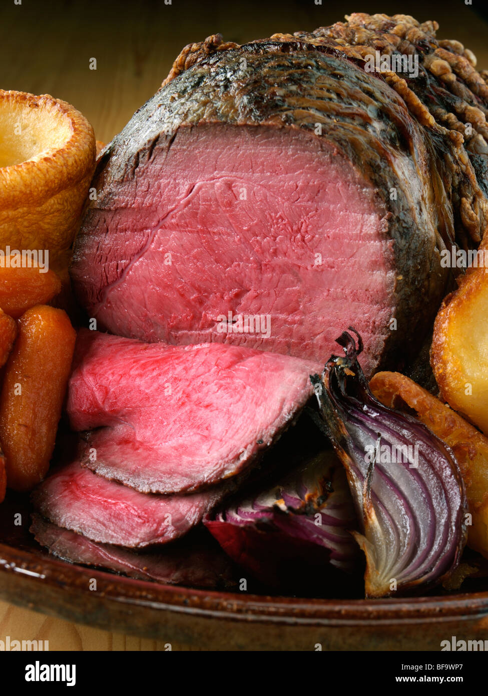 Irish roast beef joint with vegetables Stock Photo Alamy