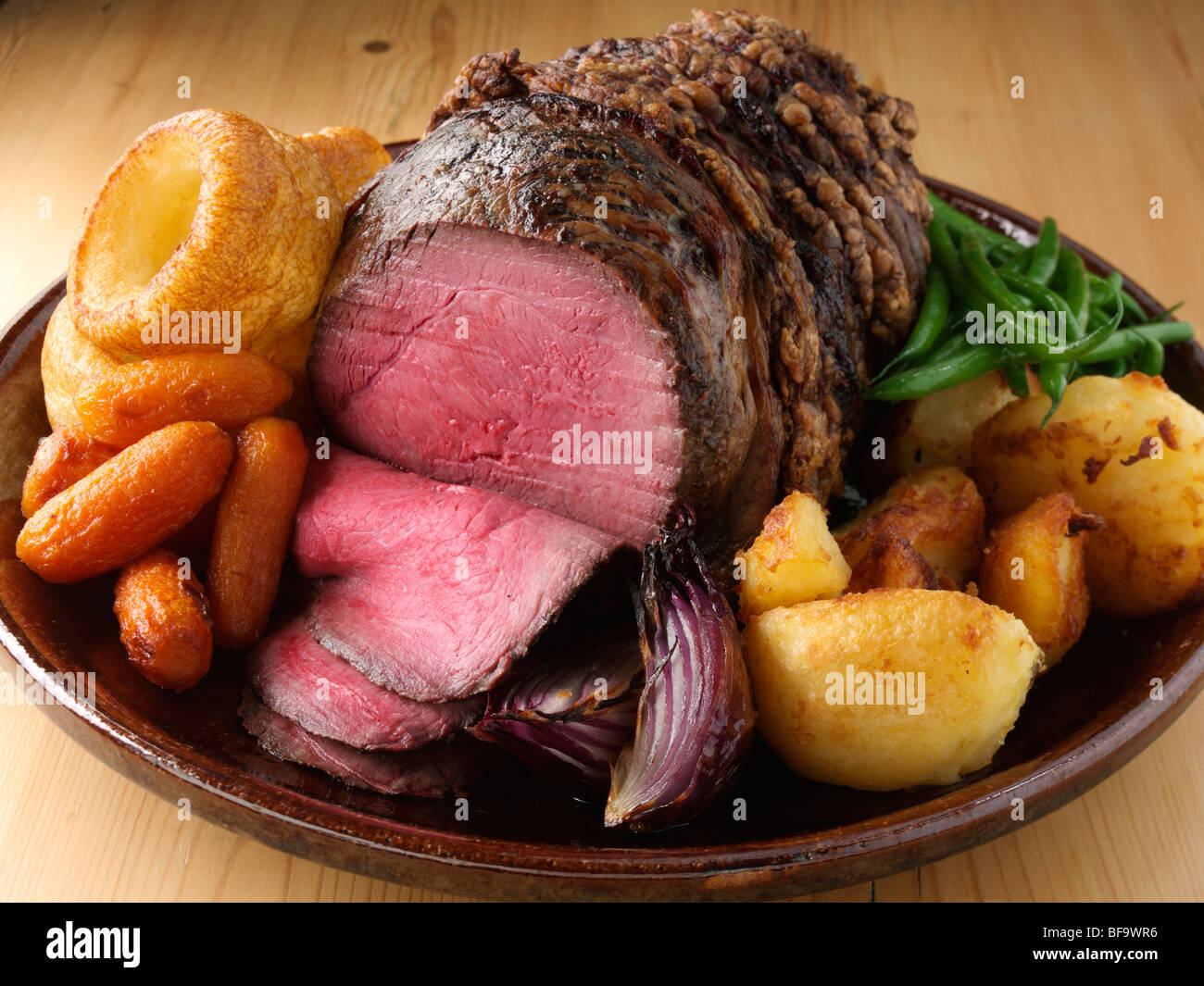 Irish roast beef joint with vegetables Stock Photo - Alamy