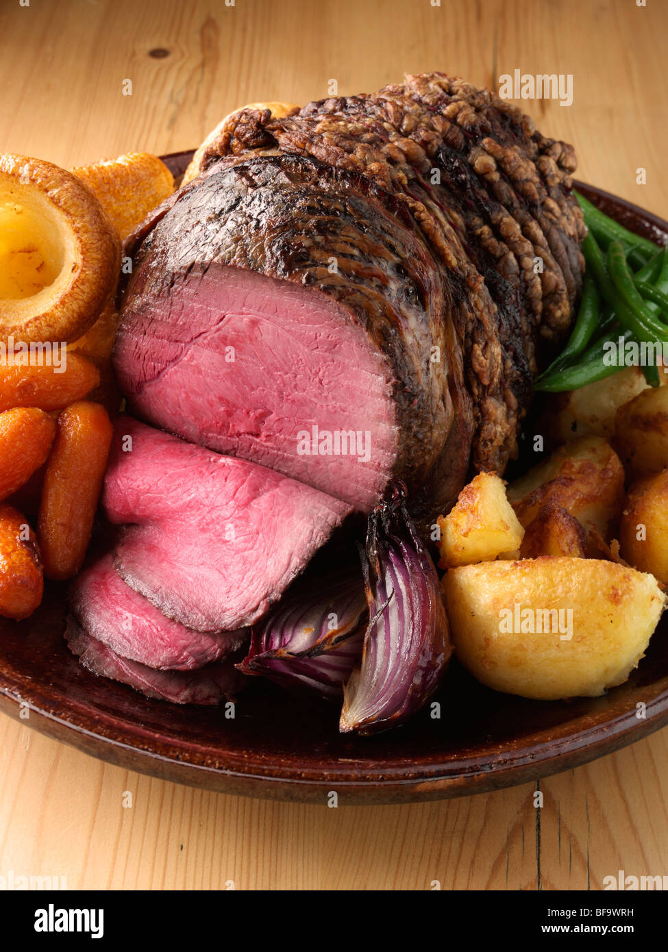 Irish roast beef joint with vegetables Stock Photo Alamy