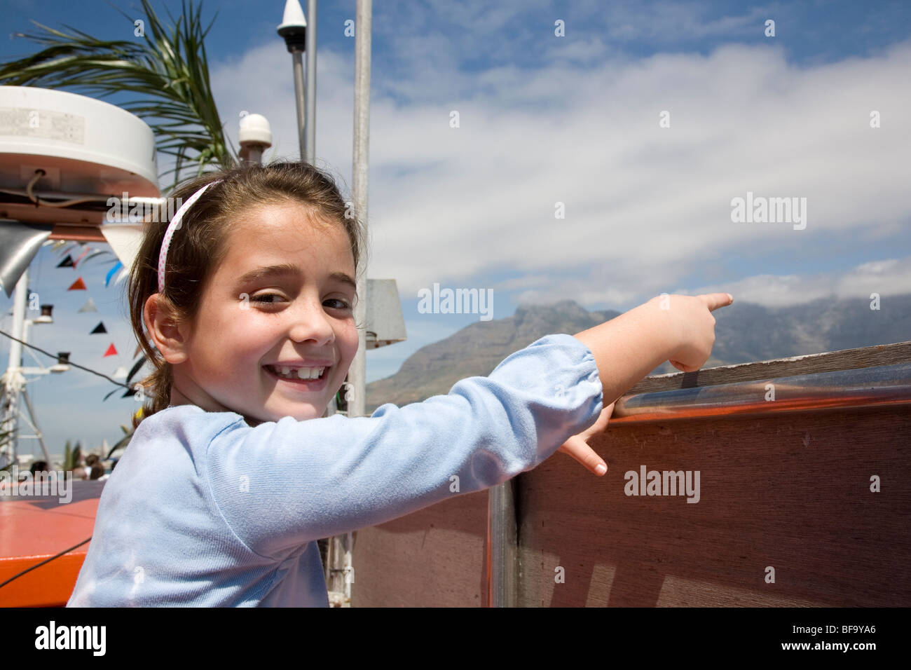 Girl on boat sightseeing in Table Bay, Cape Town Stock Photo