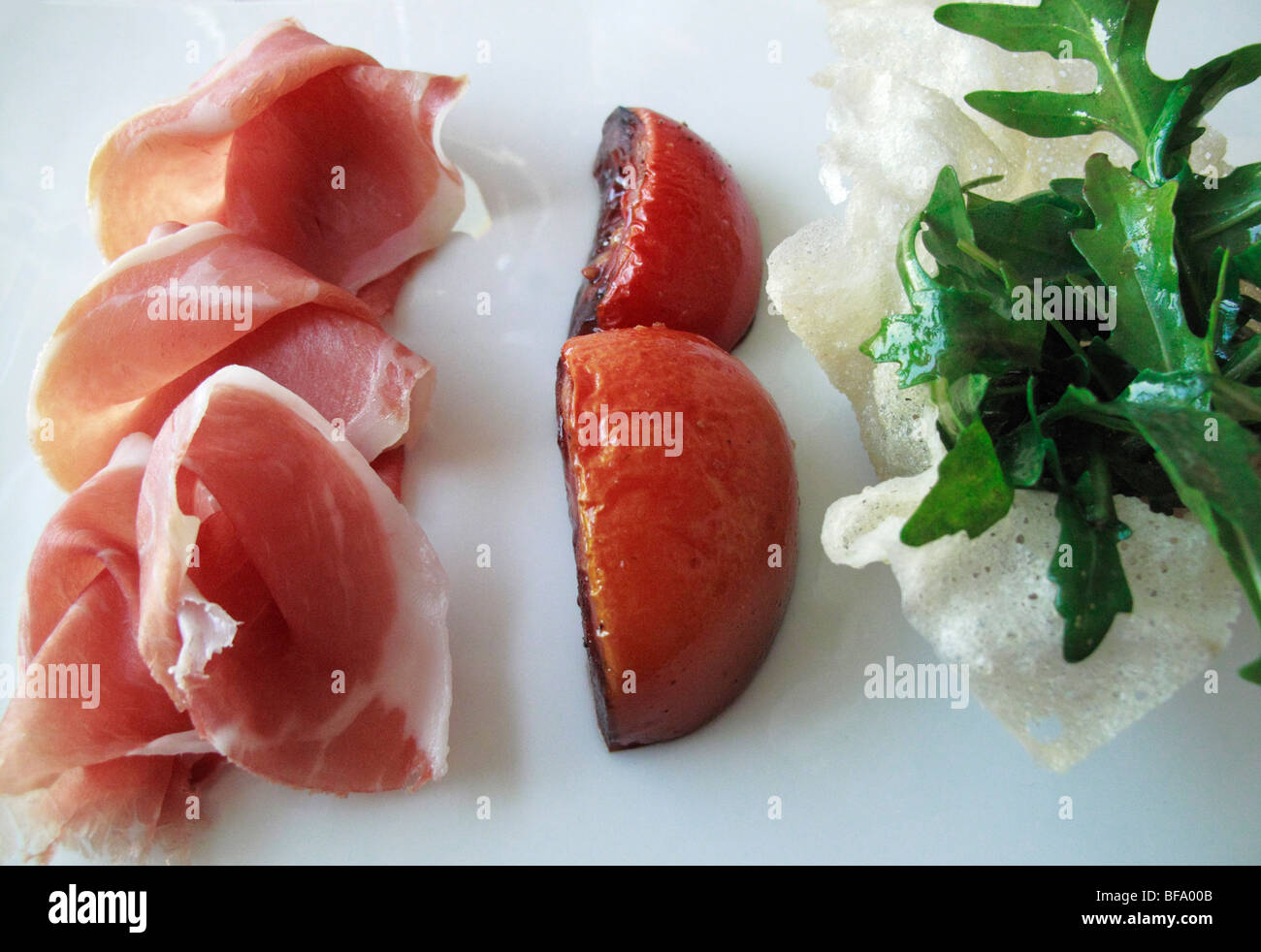Parma ham with tomato in Balsamico vinegar and Arugula salad (Restaurant L'O, Horgen CH) Stock Photo