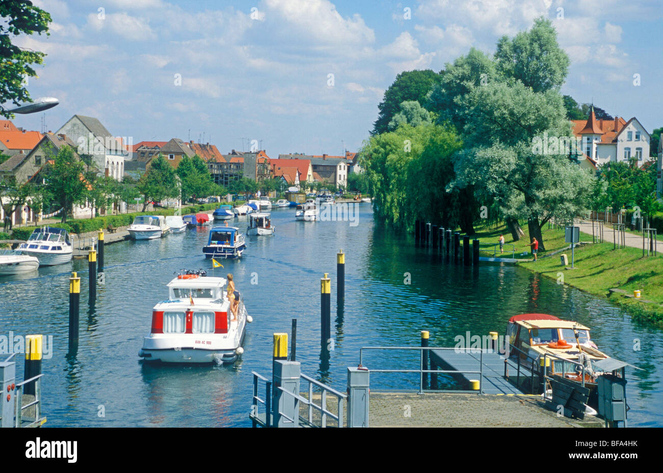 boats leaving the lock in Plau am See, Mecklenburg Lakes, Mecklenburg-West Pomerania, Germany Stock Photo