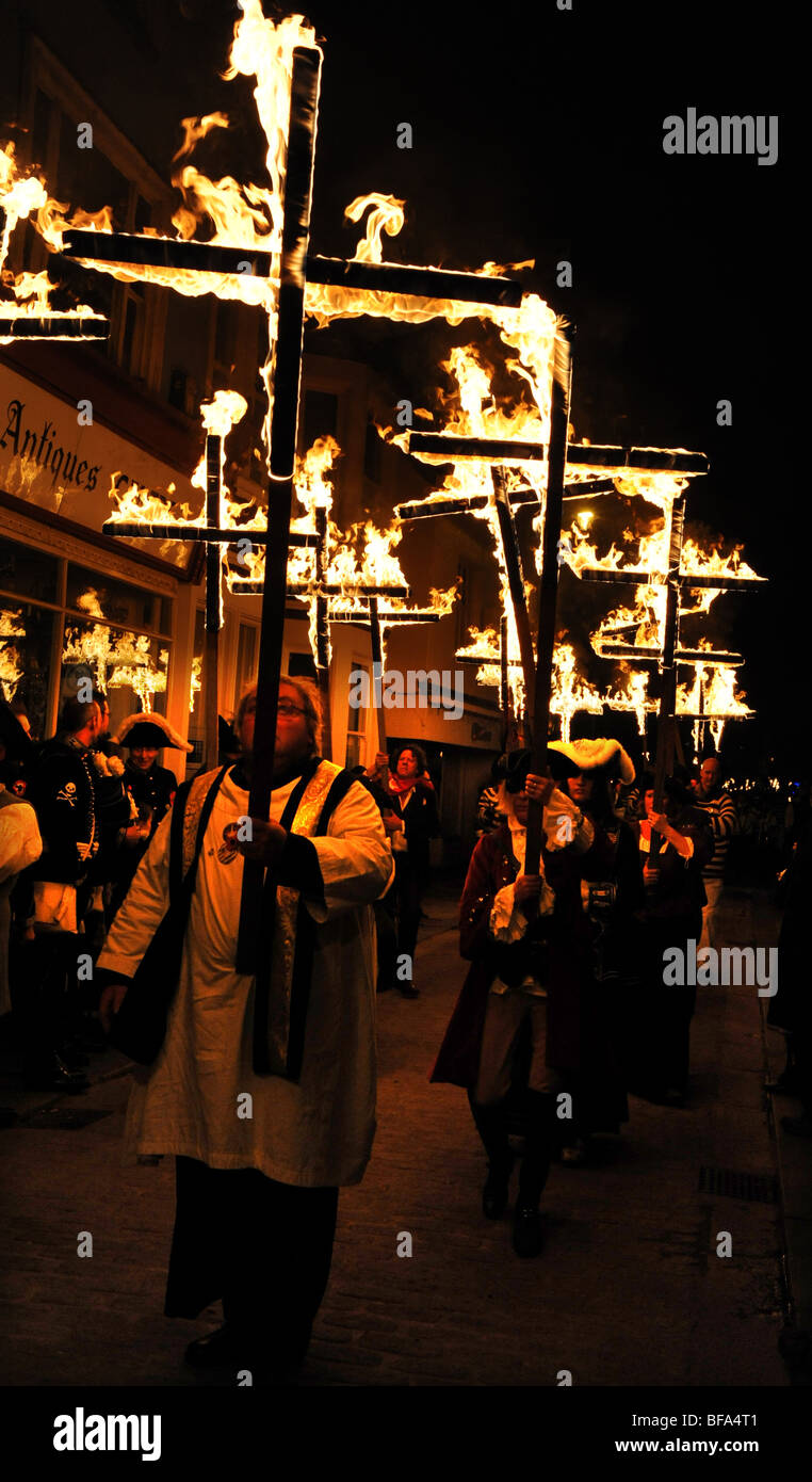 Members of the South Street Bonfire Society carry flaming crosses ...