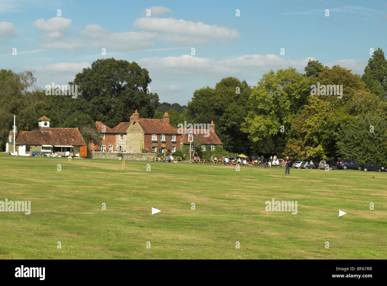 Lurgashall village green sees the potential for a game of cricket on a warm sunny autumn day. Stock Photo