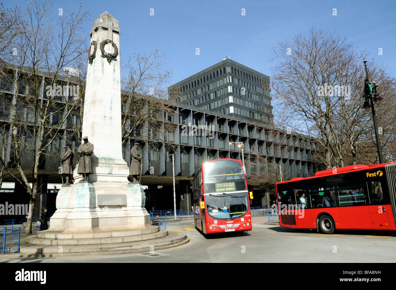 Bus leaving Euston Bus Station with war memorial on left Euston Road