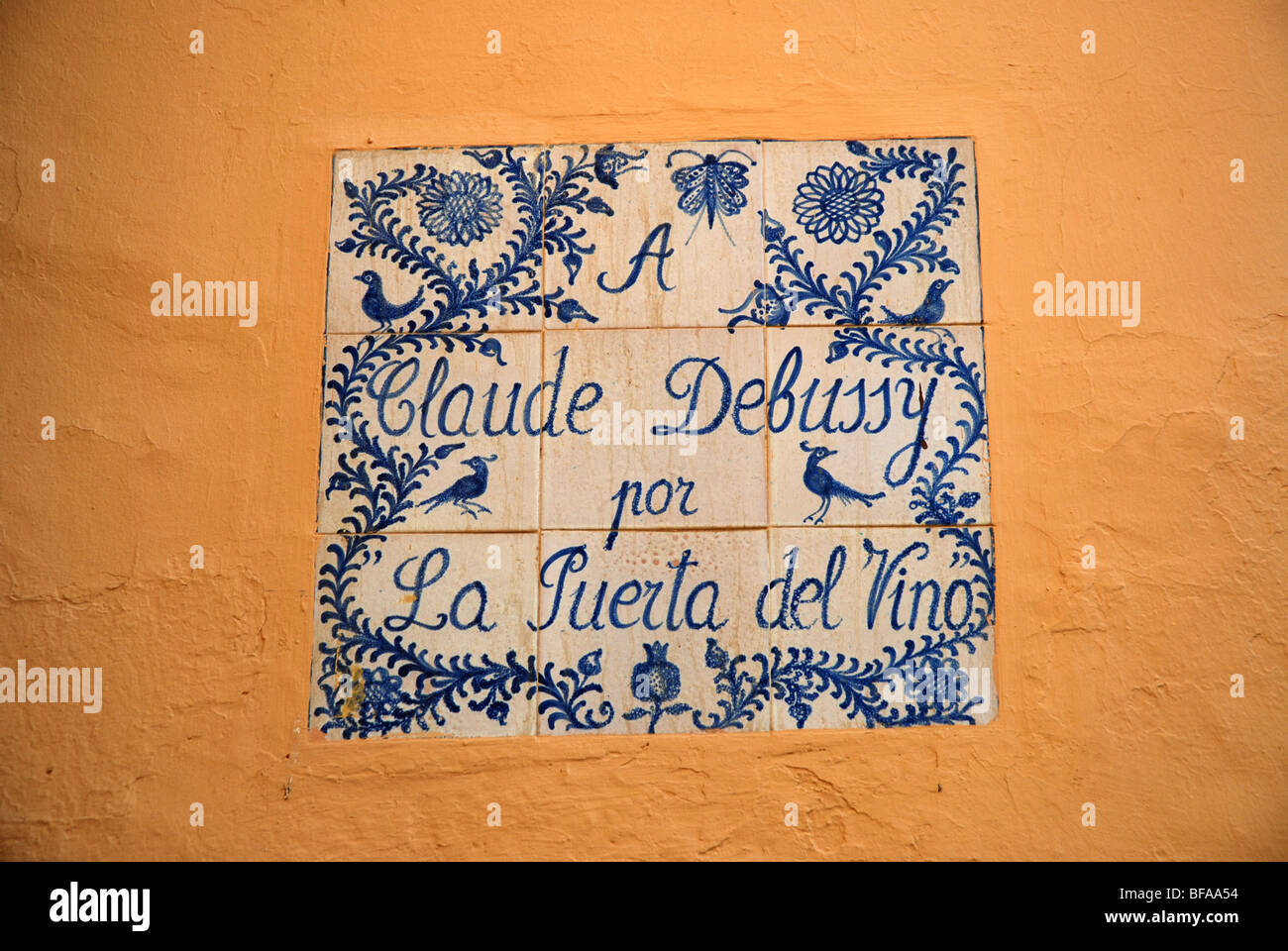 tiled wall sign, 'A Claude Debussy por La Puerta del Vino', Alhambra, Granada, Andalusia, Spain Stock Photo