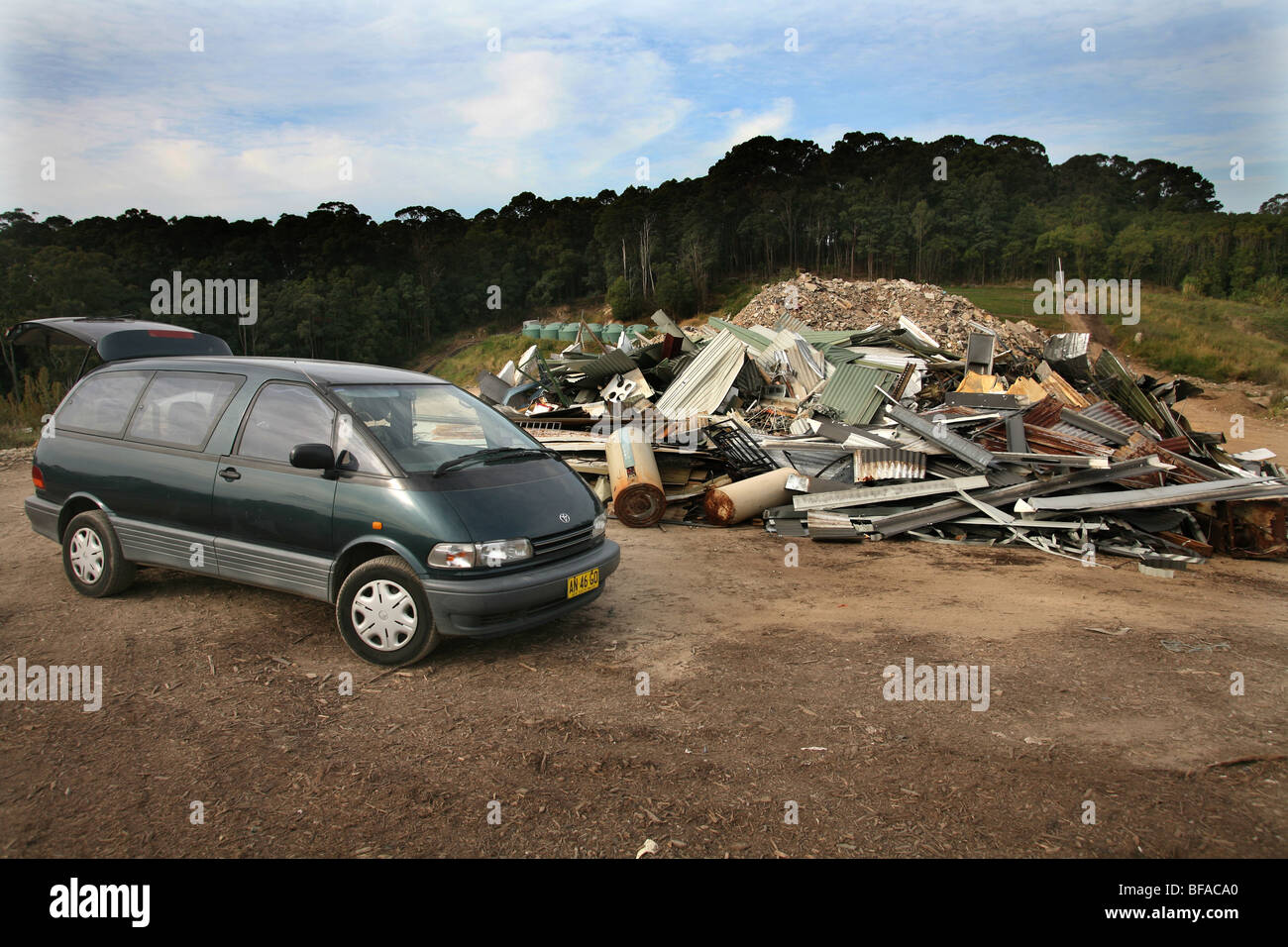 Late model van with metal at dump about to be recycled Stock Photo