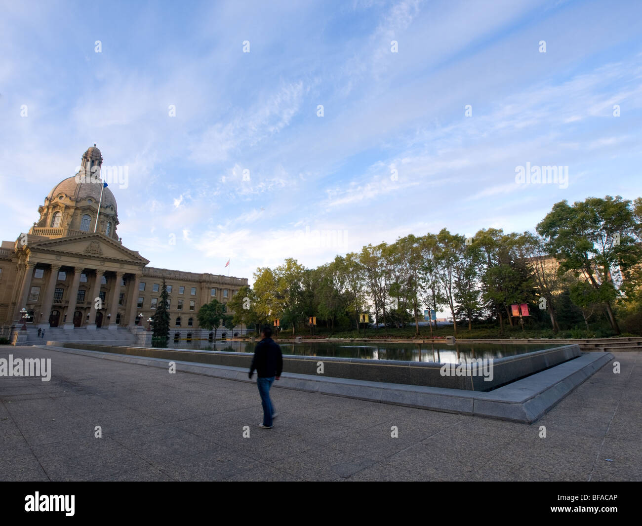 A man walking at the Alberta Legislature grounds in Edmonton, Canada. Stock Photo