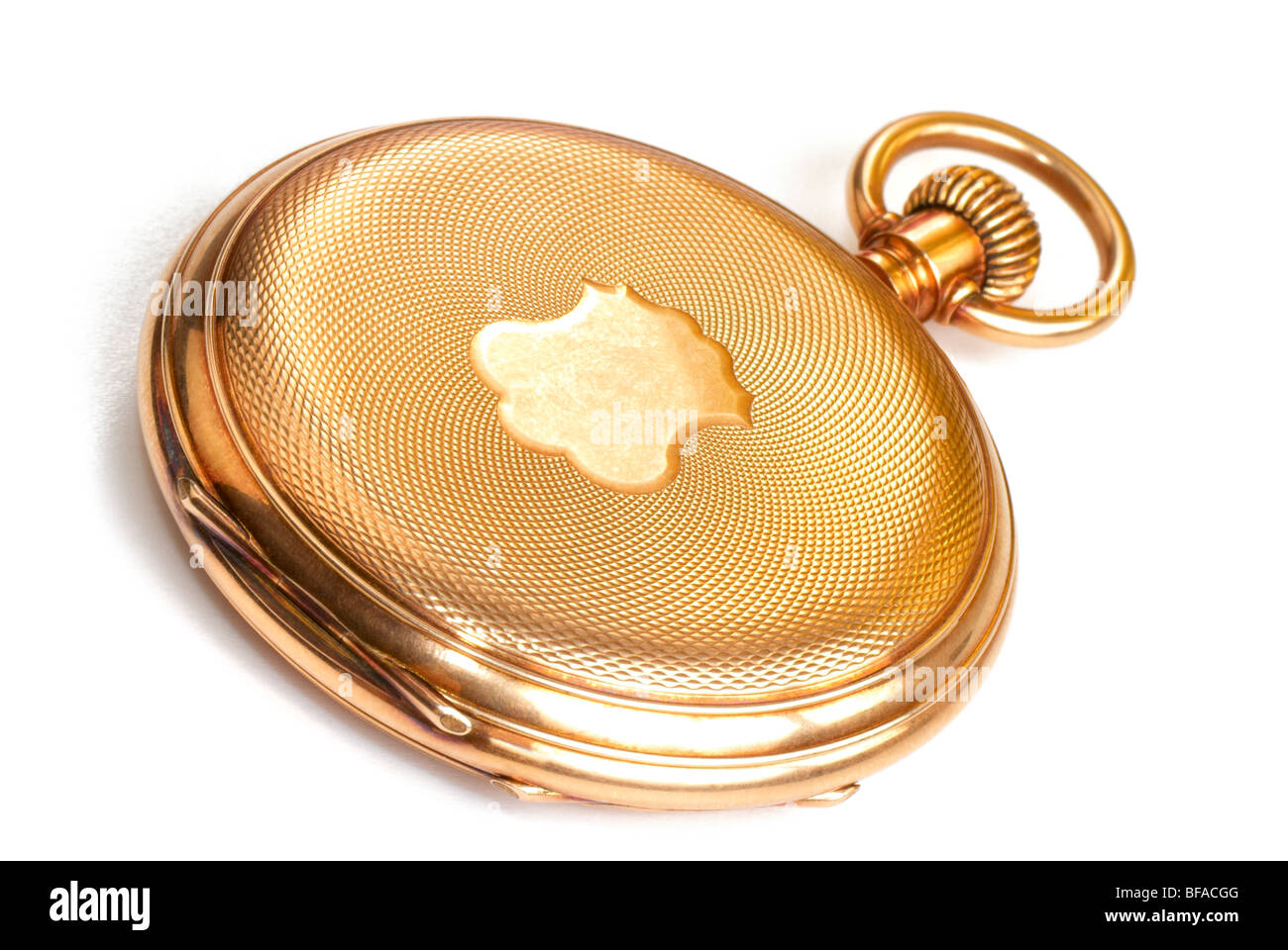 Golden pocket watch. Macro. On the white background with shadow. Stock Photo