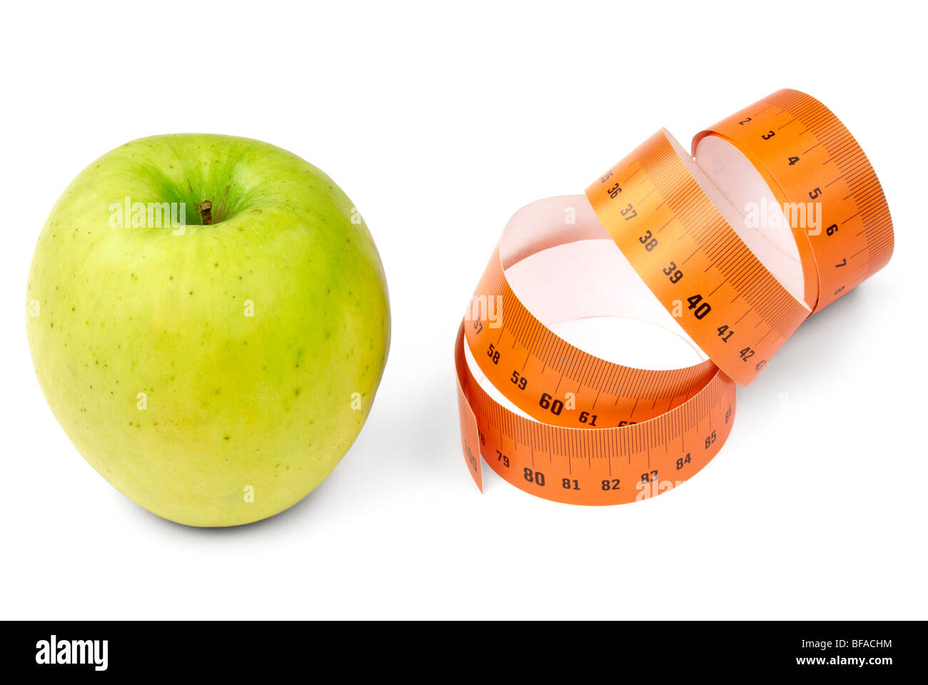 Green apple and orange measurement tape. Diet concept Stock Photo Alamy